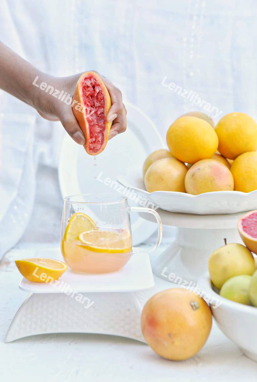 Person squeezing an orange